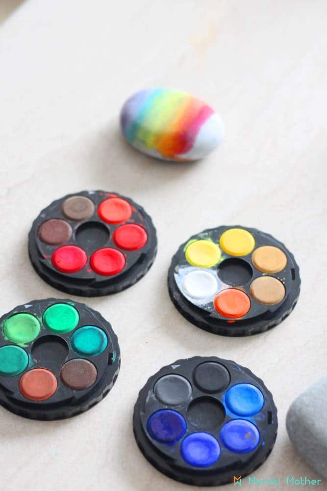 Rainbow watercolor rock painting activity for kids 