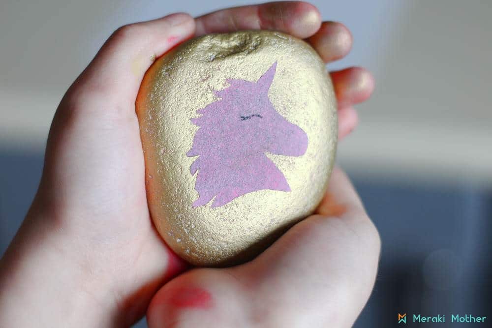 painting unicorn on a stone