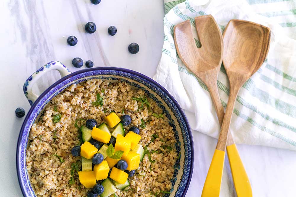 Zesty Quinoa Salad with mangos, blueberries, and cucumbers